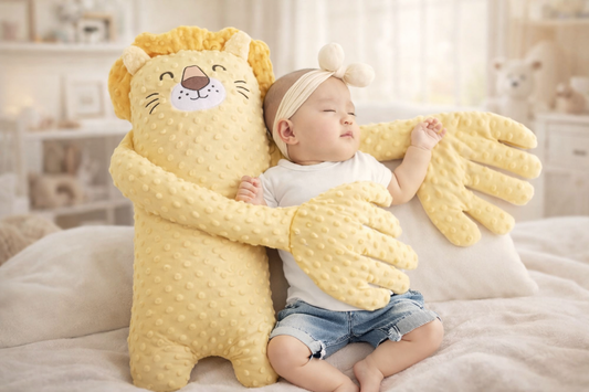 Baby hugging a large yellow lion-shaped plush toy in a cozy room.
