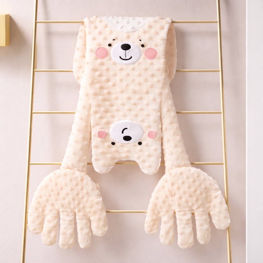 Cute animal-themed baby comfort blanket with bear design on a wire rack.