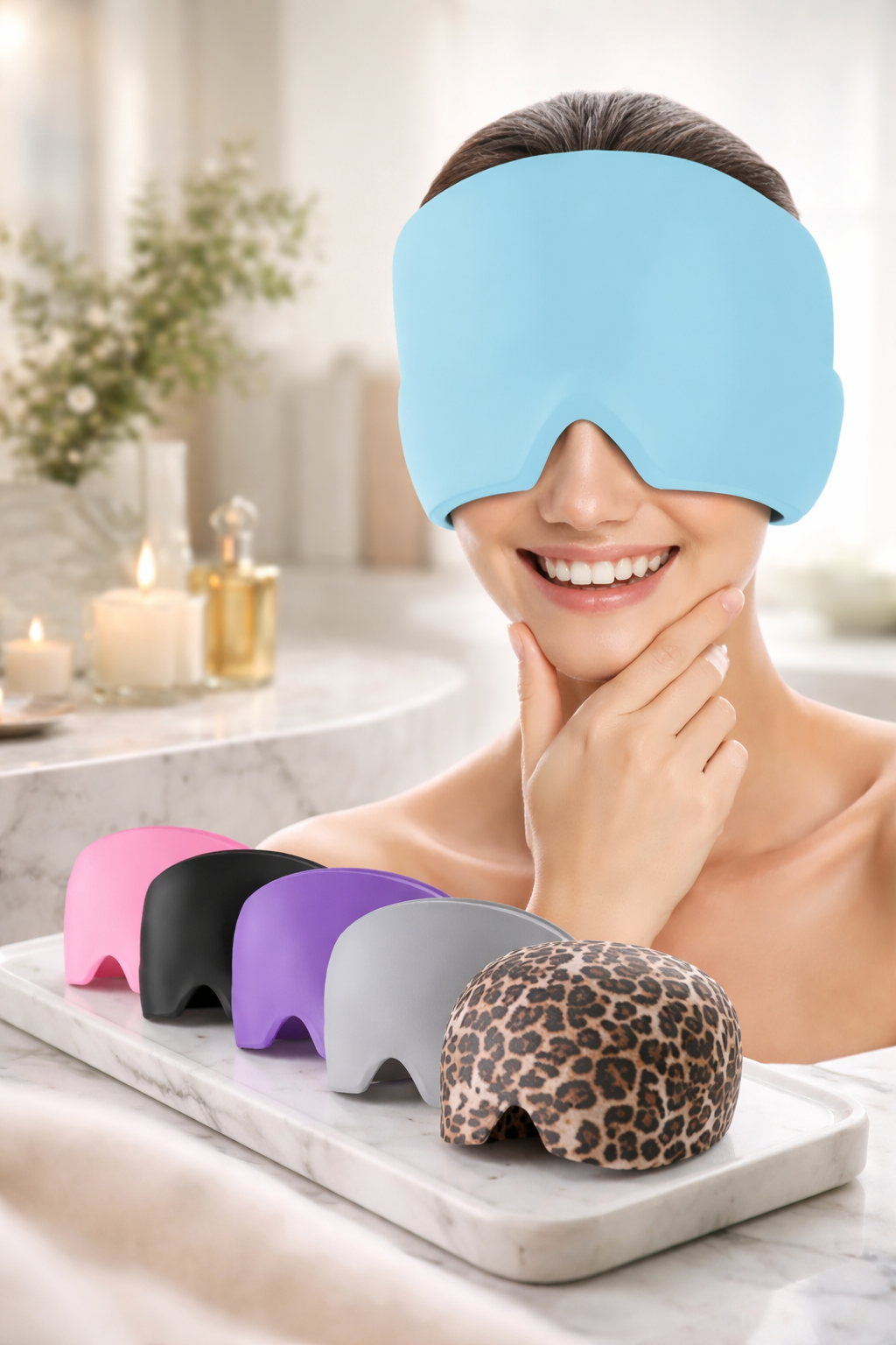 Woman wearing a blue sleep mask with various colored masks displayed below in a spa setting.